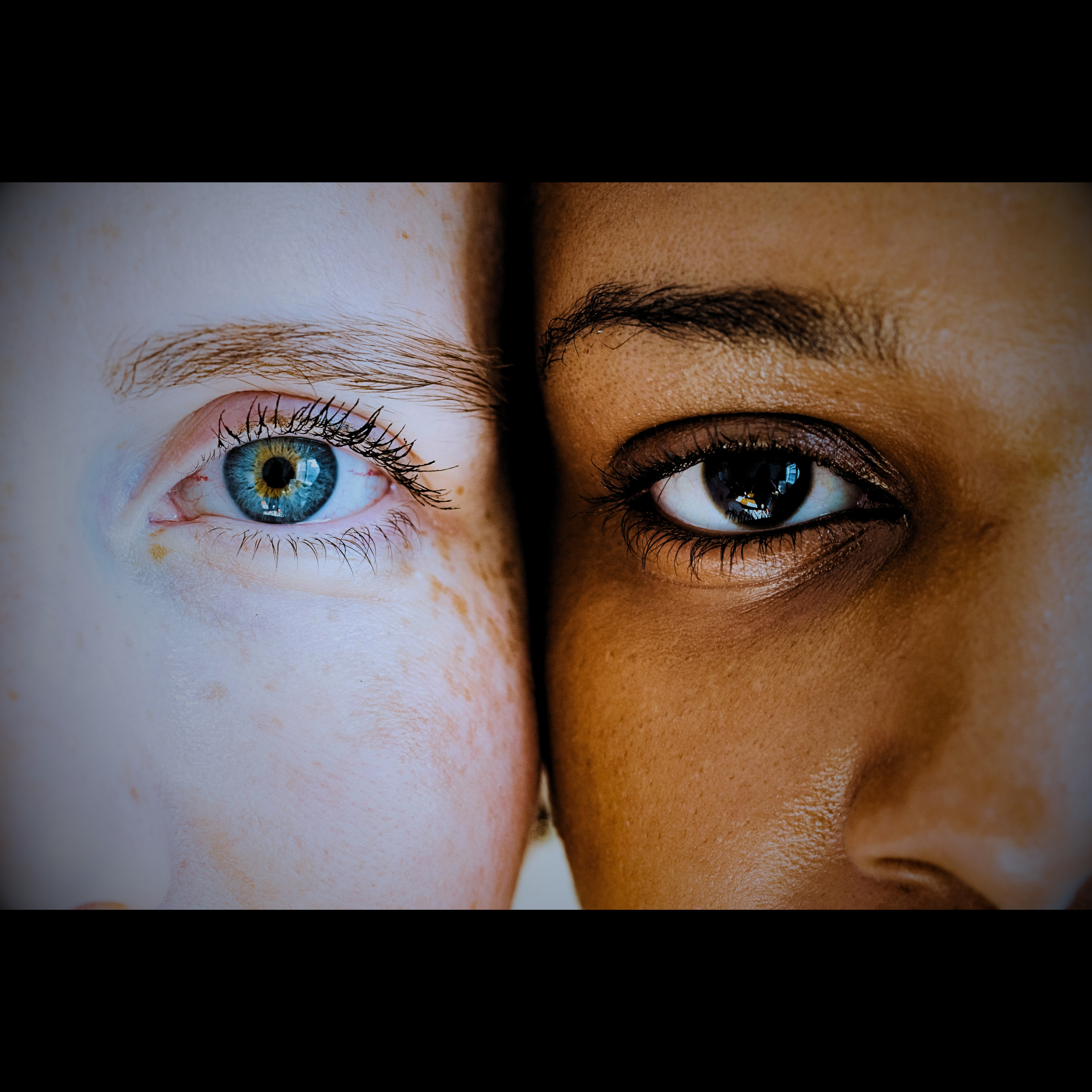 Close-up of two women’s eyes, symbolizing self-discovery and mindfulness.